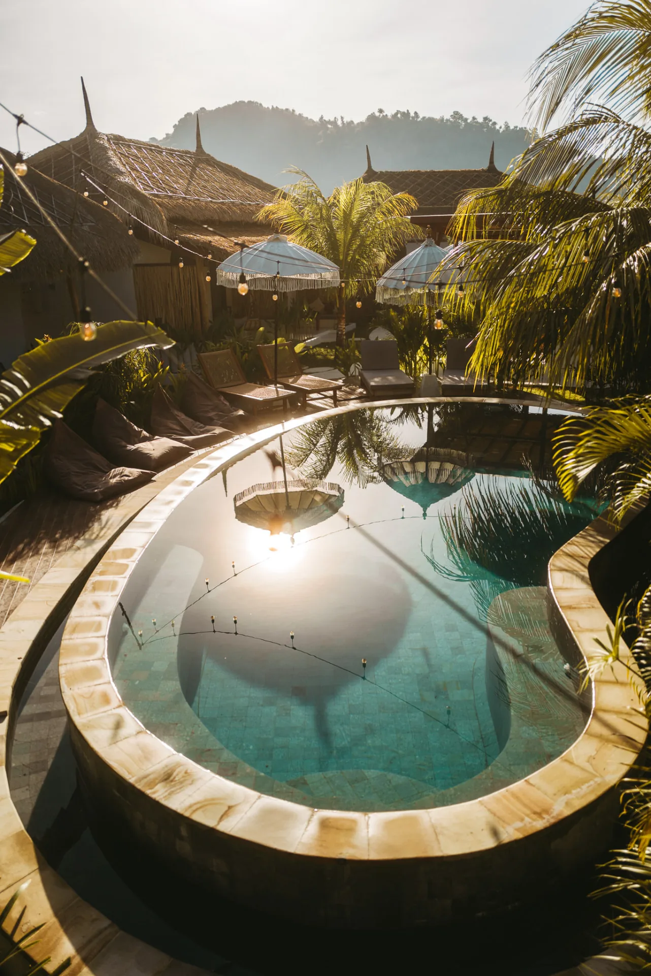 Swimming pool surrounded by tropical planting at Luana Lombok, Selong Belanak
