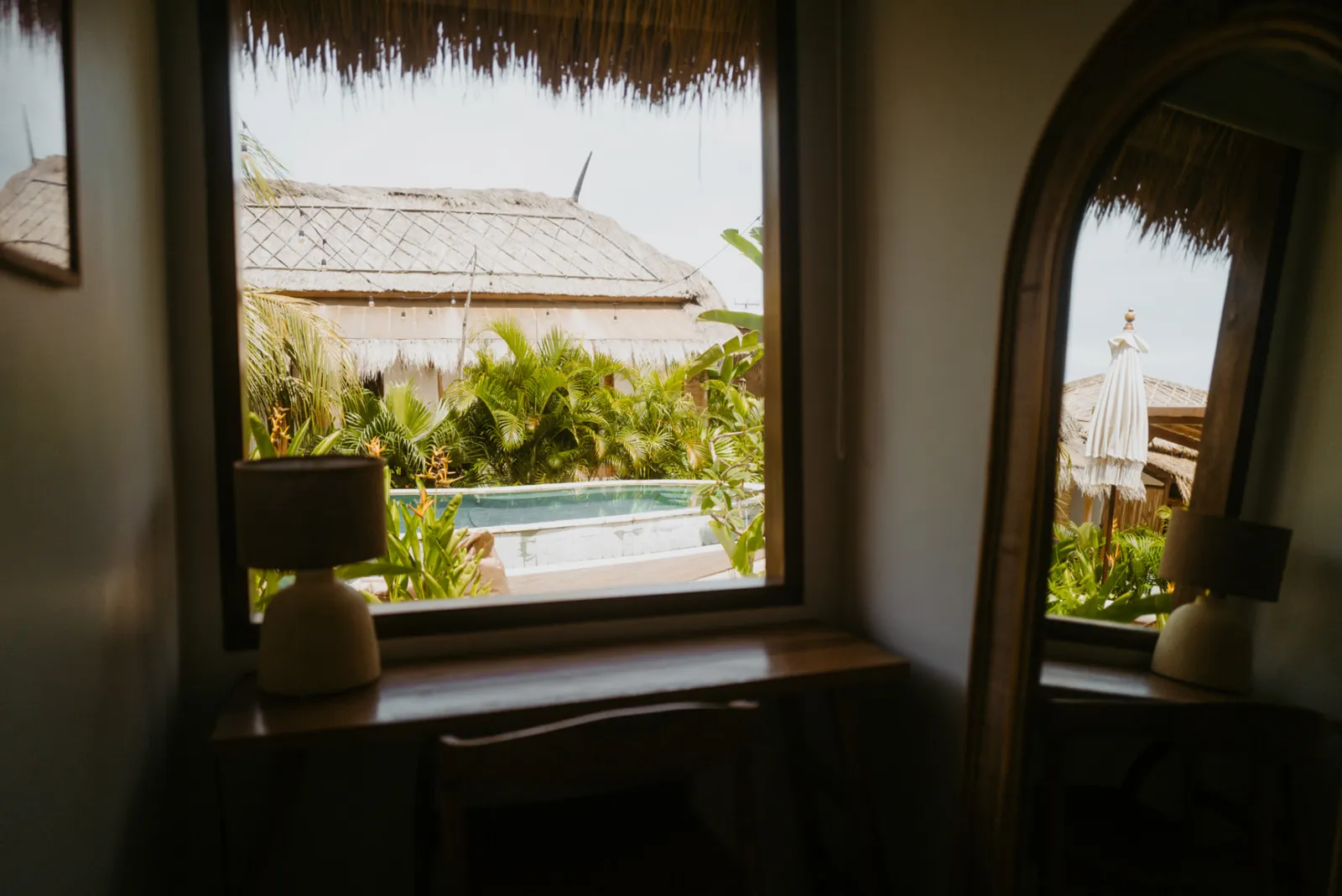Desk and window with pool view inside the Private Bungalow