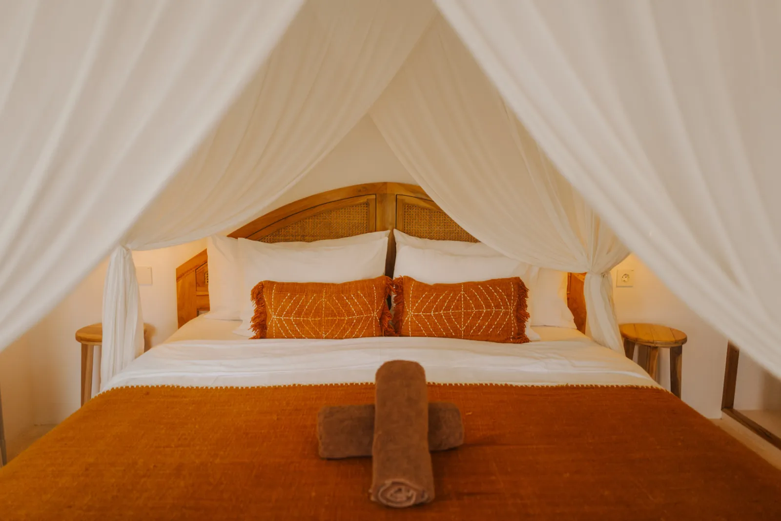 King bed with canopy in the Private Bungalow