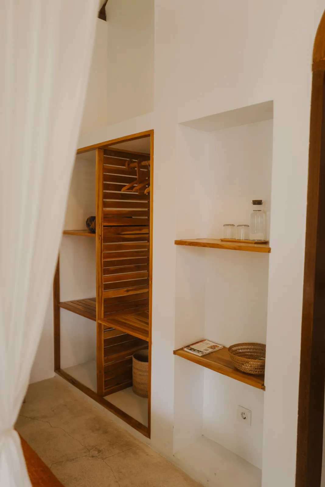 Open wardrobe and shelving inside the Private Bungalow