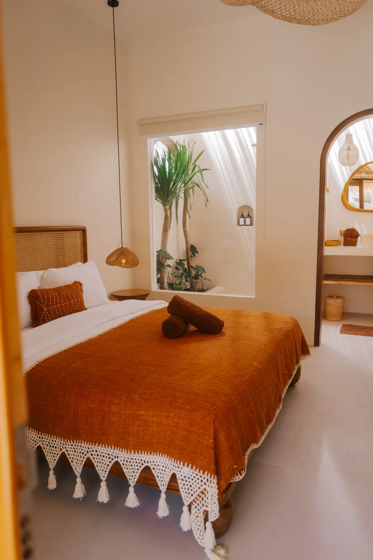 Double Bungalow bedroom at Luana Lombok with warm tropical interior